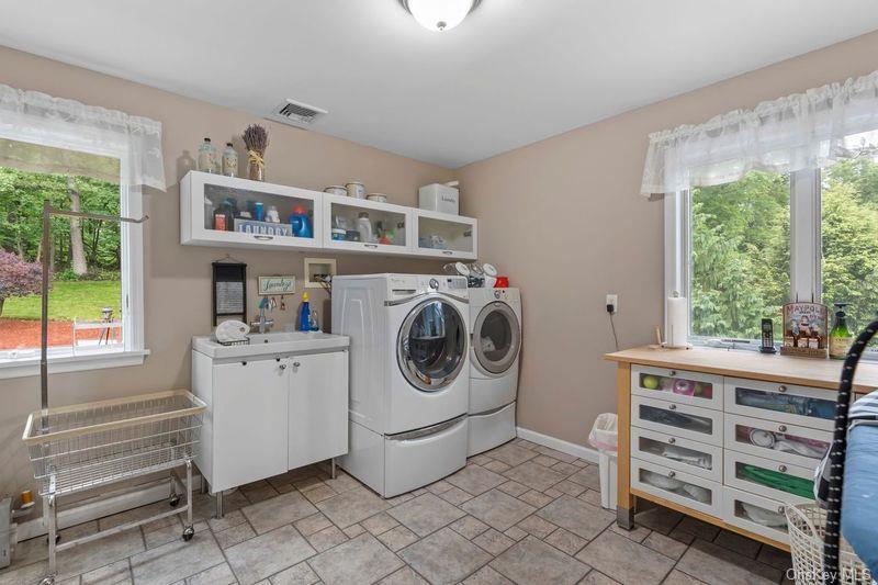 266 Shear Hill Road Mahopac, NY 10541 - Photo 19 of 34 a utility room with cabinets dryer and washer