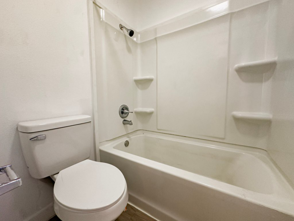 4500 Witham Lane, Unit 101 Austin, TX 78745 - Photo 13 of 27 Bathroom with toilet and shower combination