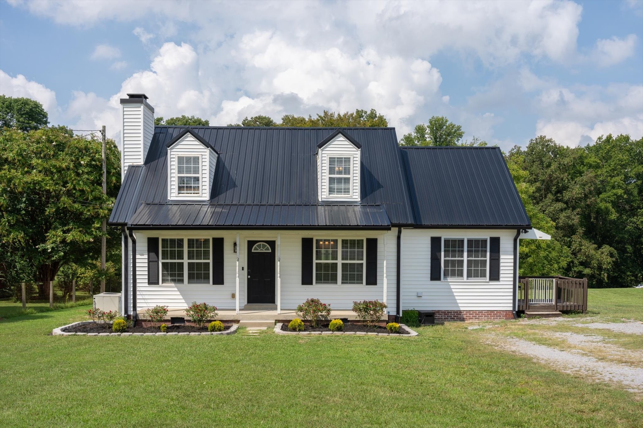 front view of a house with a yard