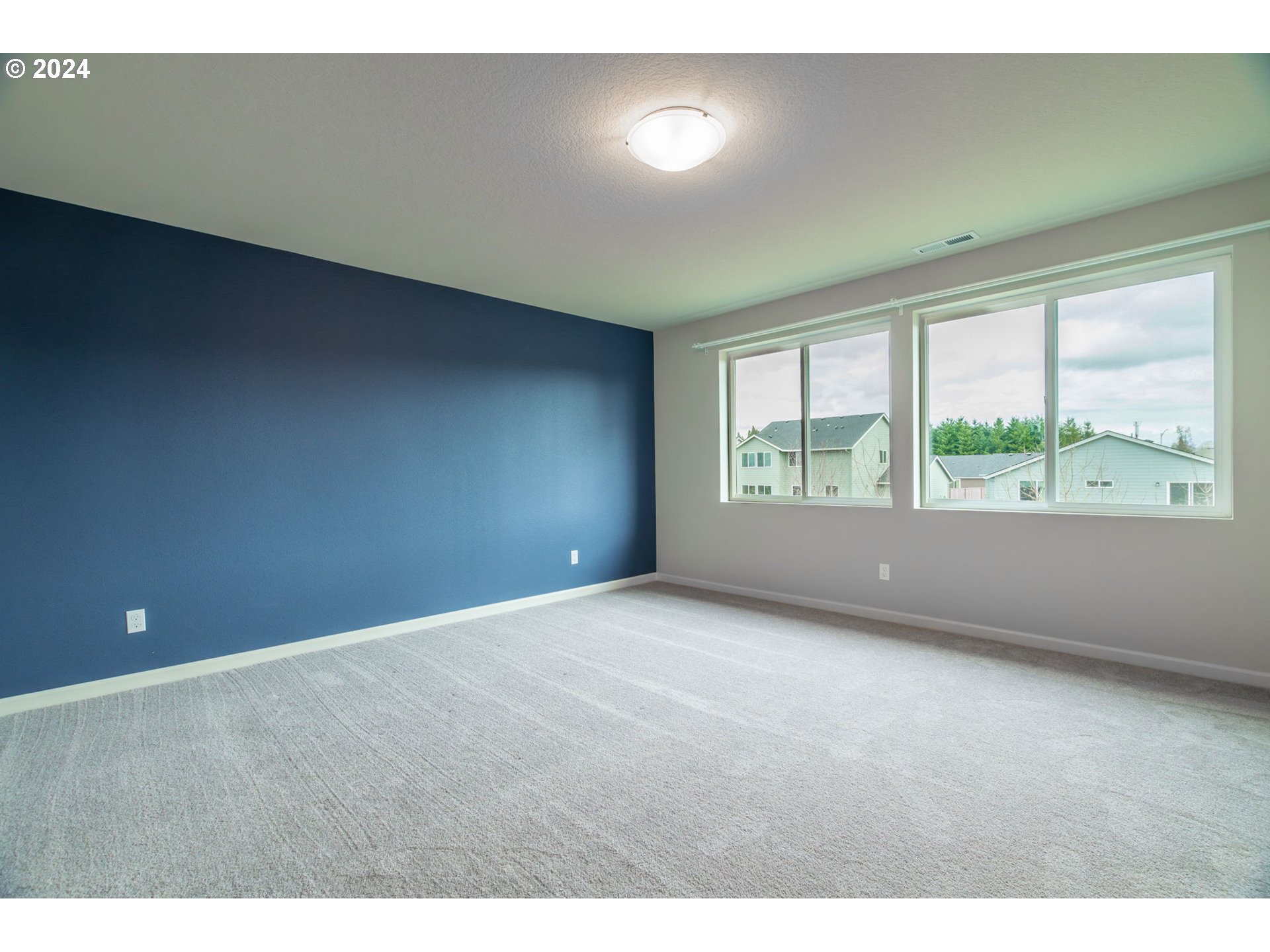 235 Walnut Street Mount Angel, OR 97362 - Photo 12 of 25 a view of an empty room with a window