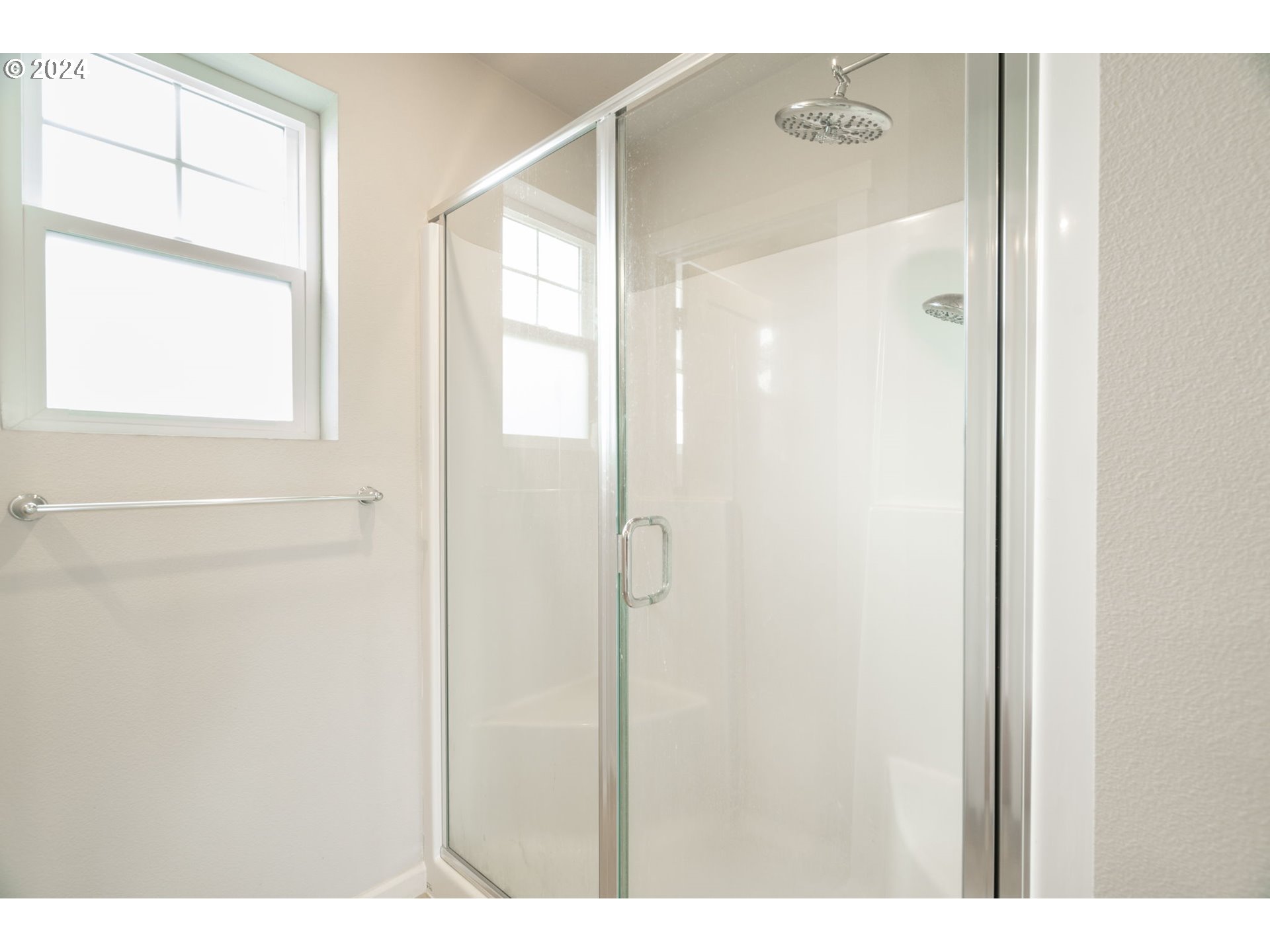 235 Walnut Street Mount Angel, OR 97362 - Photo 16 of 25 a bathroom with a glass shower door