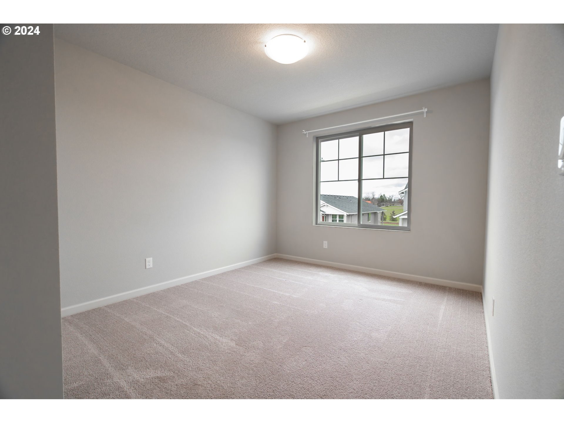 235 Walnut Street Mount Angel, OR 97362 - Photo 17 of 25 a view of an empty room with a window