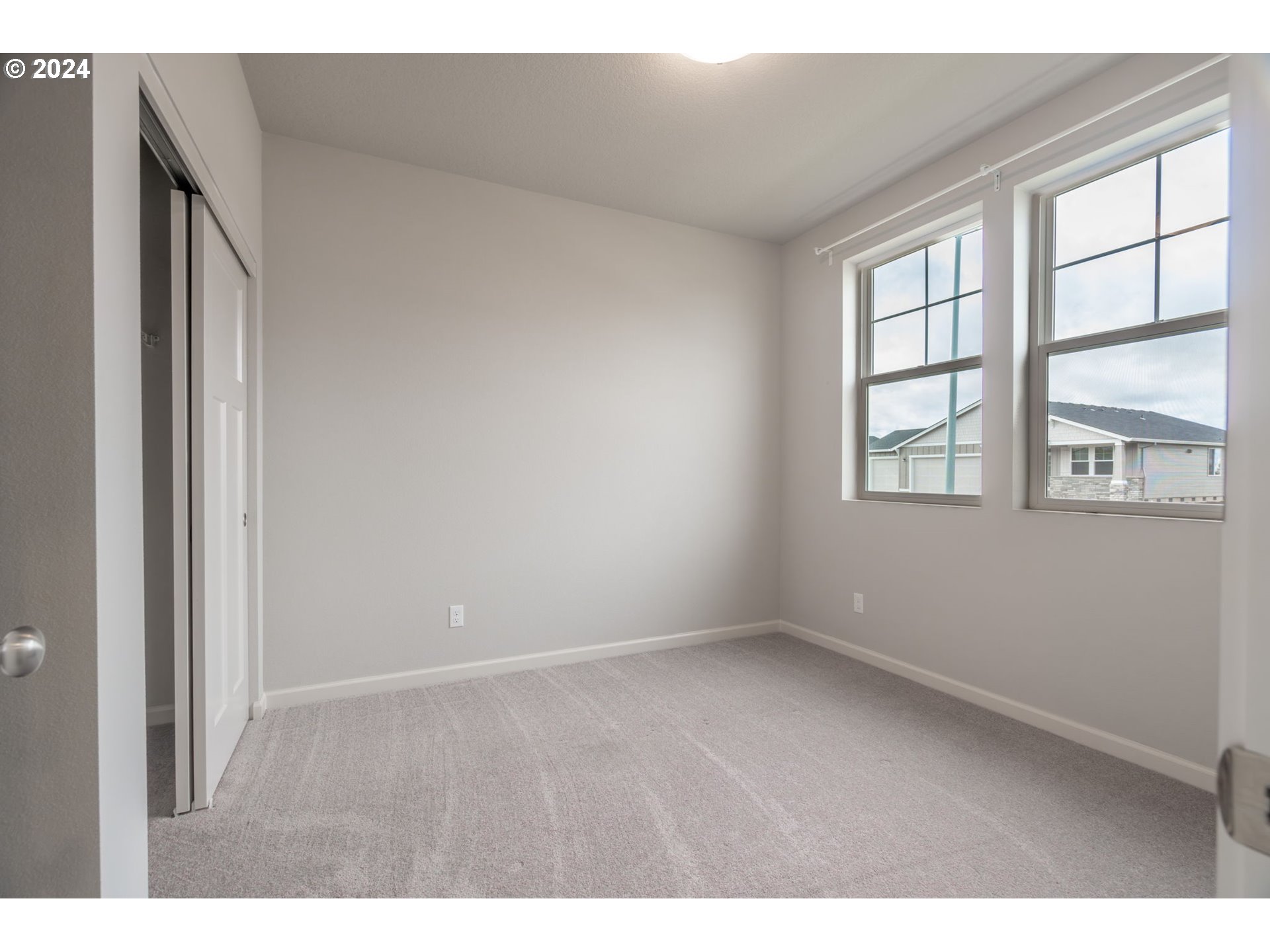 235 Walnut Street Mount Angel, OR 97362 - Photo 18 of 25 a view of an empty room with a window