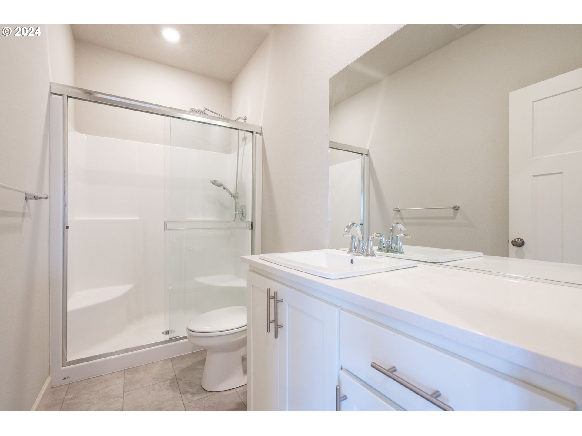 235 Walnut Street Mount Angel, OR 97362 - Photo 21 of 25 a bathroom with a sink a toilet and shower