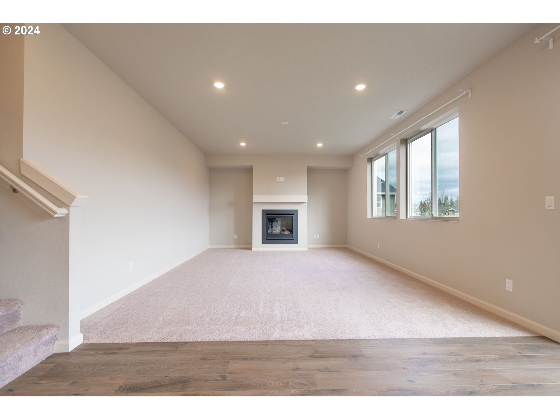 235 Walnut Street Mount Angel, OR 97362 - Photo 5 of 25 a view of an empty room with a fireplace and a window