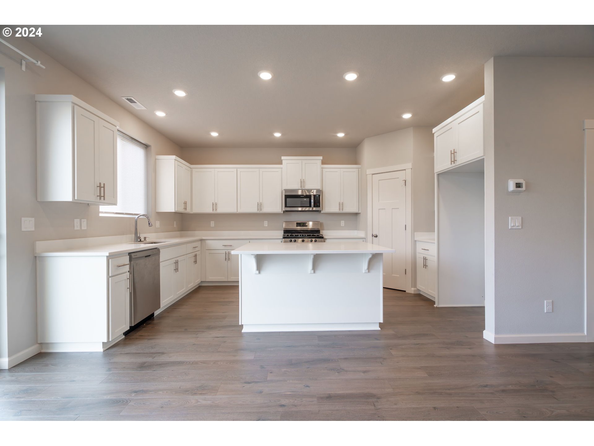 235 Walnut Street Mount Angel, OR 97362 - Photo 10 of 25 a view of kitchen with granite countertop refrigerator