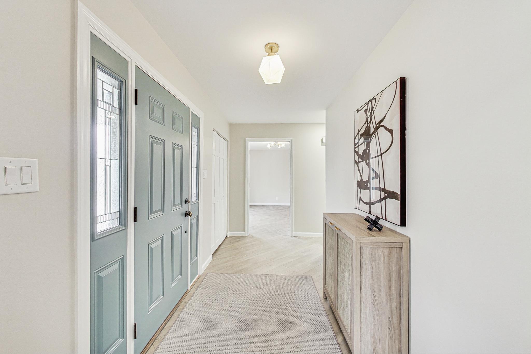 22 Chrismar Road Ogden Dunes, IN 46368 - Photo 2 of 26 a view of a hallway with wooden floor and entryway