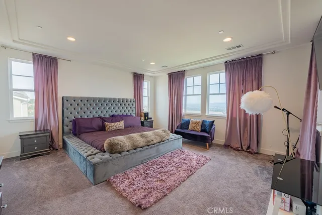 a large bathroom with a large tub shower and sink