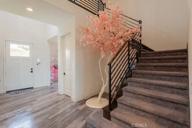 a view of entryway with wooden floor