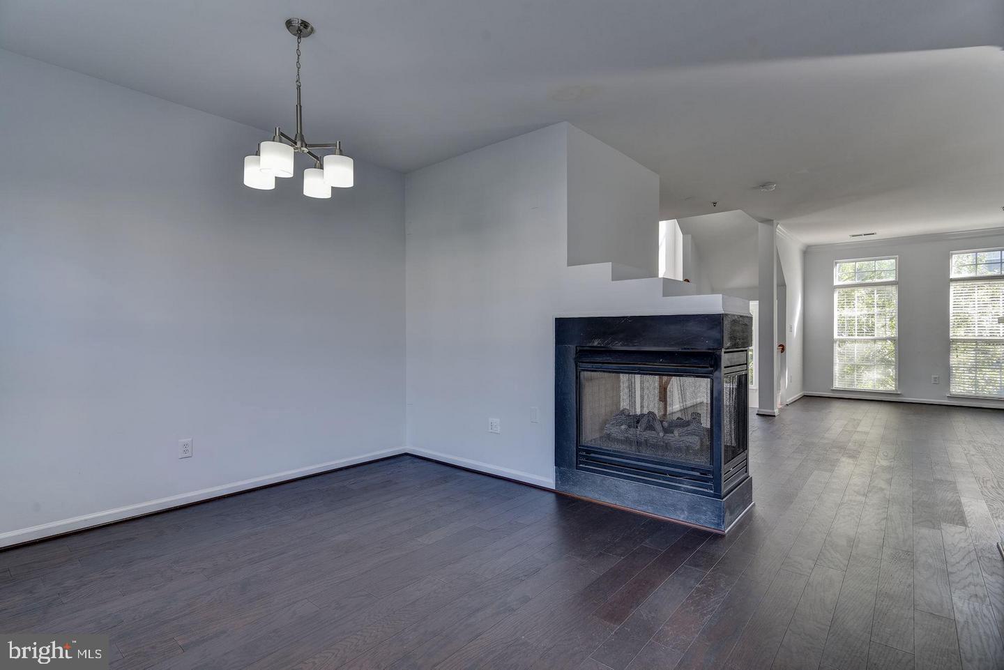 640 Main Street, Unit 640B Gaithersburg, MD 20878 - Photo 15 of 65 a view of wooden floor fire place and windows in a room