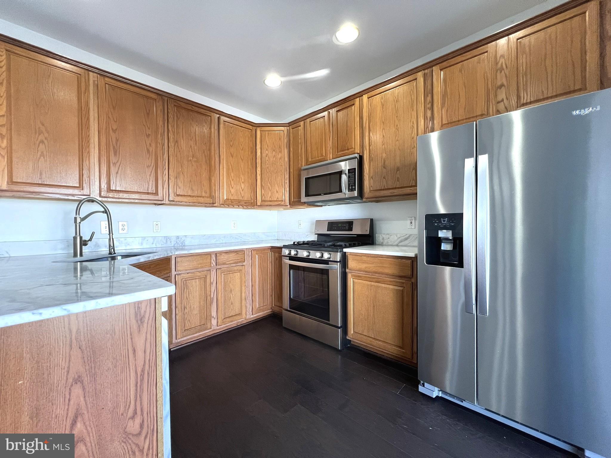 640 Main Street, Unit 640B Gaithersburg, MD 20878 - Photo 20 of 65 a kitchen with stainless steel appliances granite countertop a refrigerator stove and sink