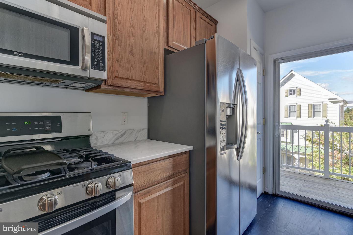 640 Main Street, Unit 640B Gaithersburg, MD 20878 - Photo 23 of 65 a kitchen with stainless steel appliances granite countertop a stove a refrigerator and a microwave