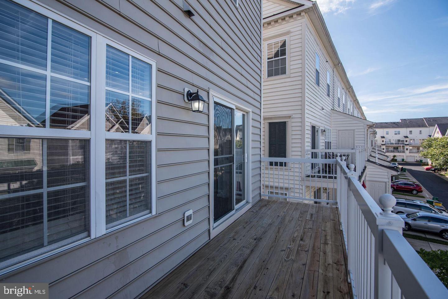 640 Main Street, Unit 640B Gaithersburg, MD 20878 - Photo 24 of 65 a view of a house with a barbeque and wooden stairs