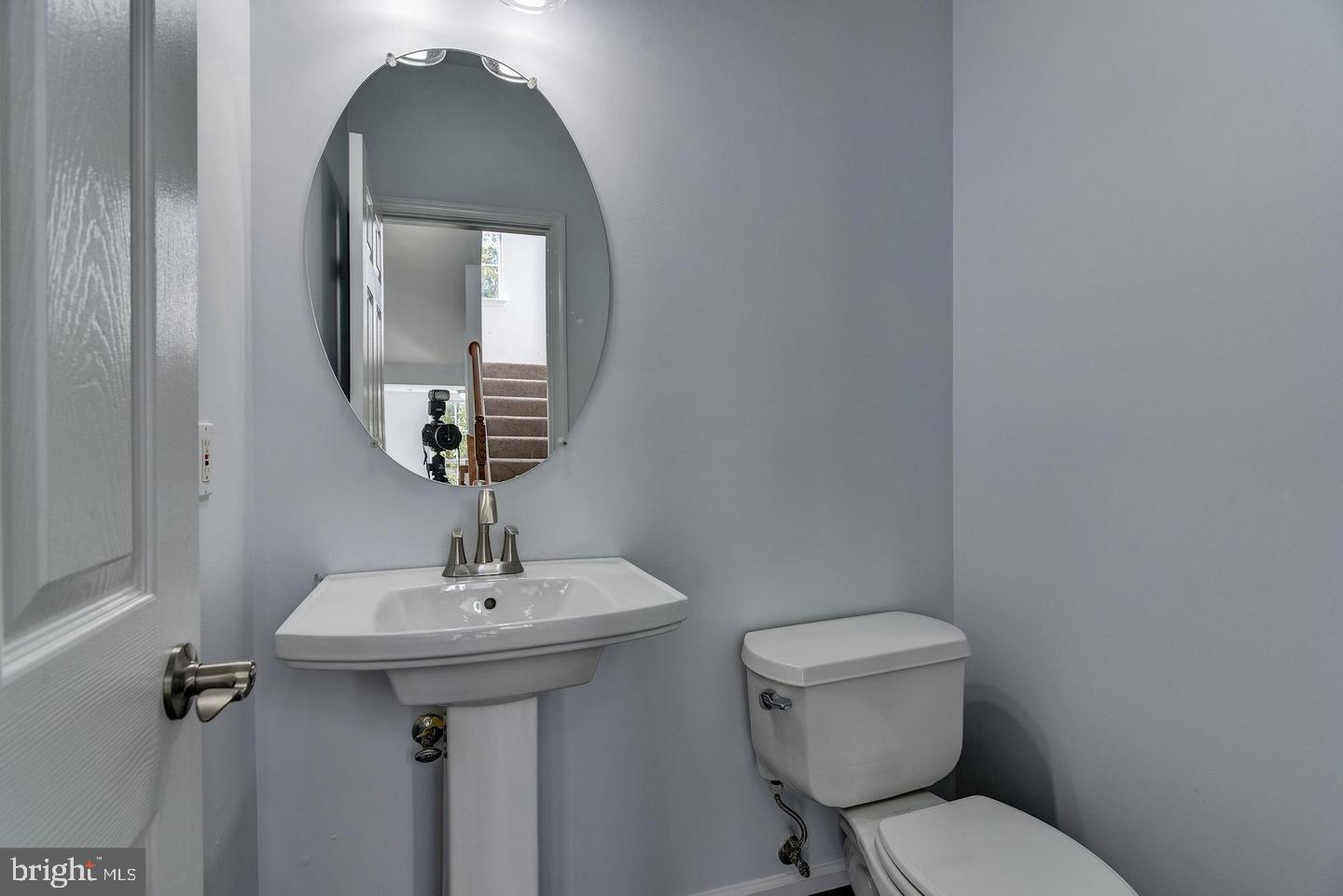 640 Main Street, Unit 640B Gaithersburg, MD 20878 - Photo 25 of 65 a bathroom with a toilet sink and mirror