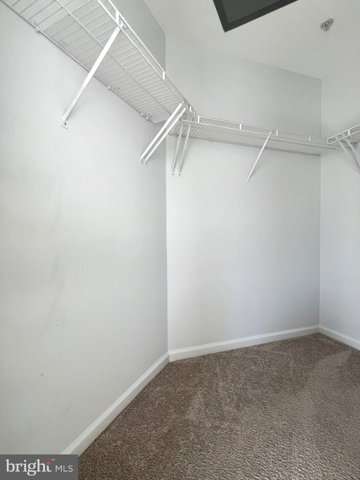 640 Main Street, Unit 640B Gaithersburg, MD 20878 - Photo 32 of 65 a view of a room with racks on the wall