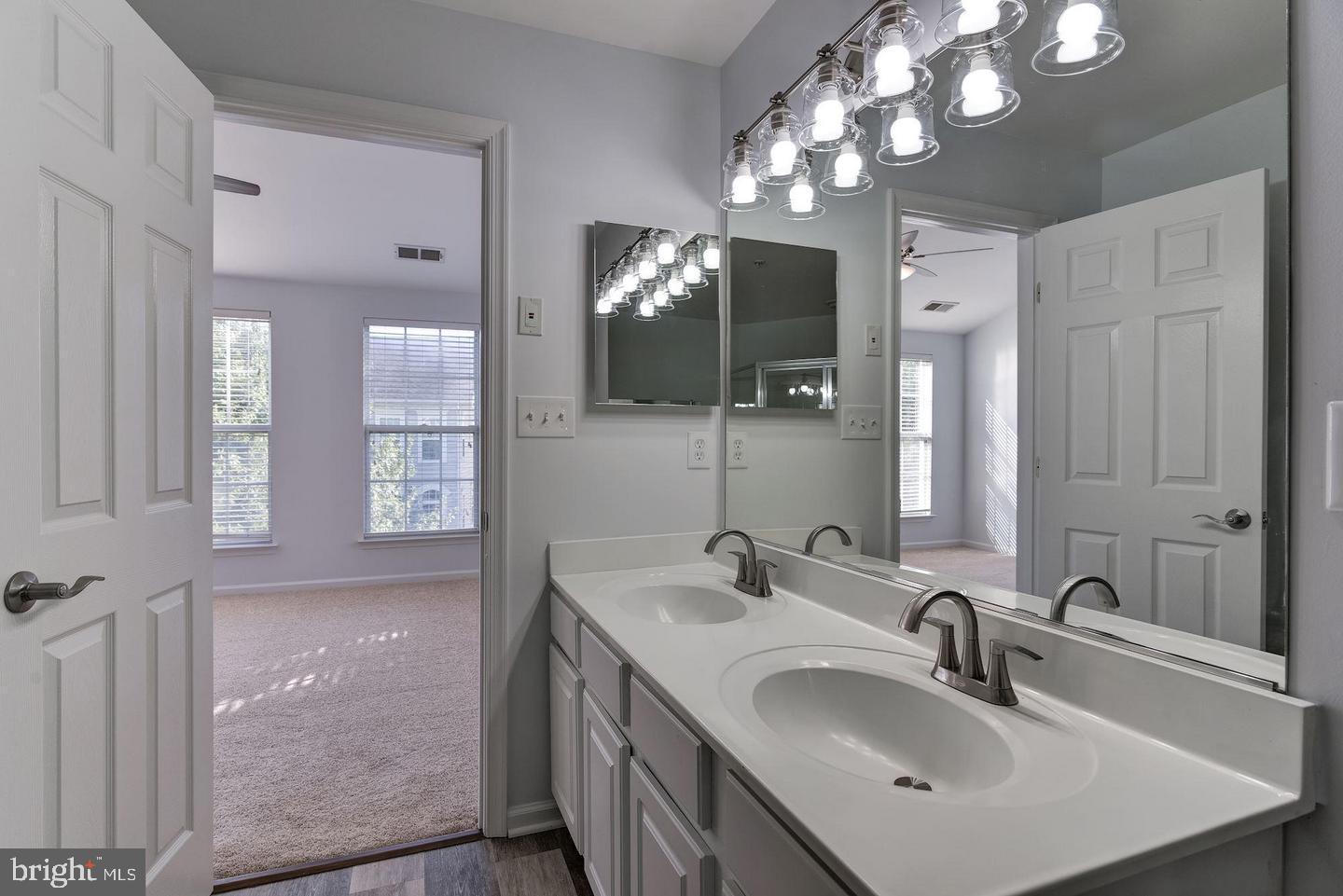 640 Main Street, Unit 640B Gaithersburg, MD 20878 - Photo 34 of 65 a bathroom with a sink double vanity and a mirror