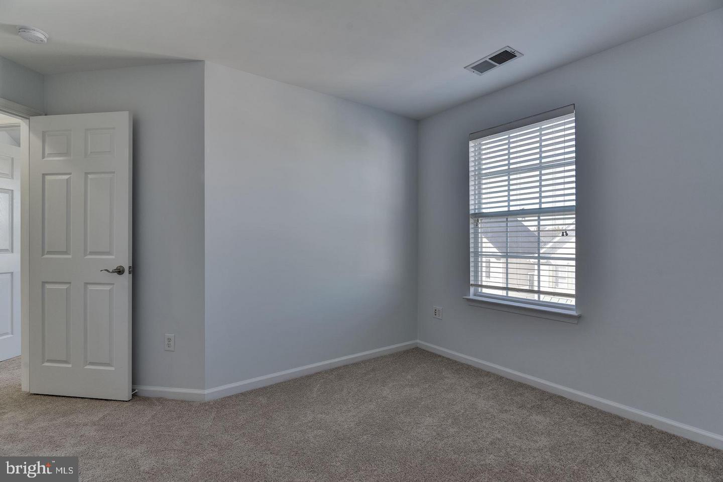640 Main Street, Unit 640B Gaithersburg, MD 20878 - Photo 38 of 65 a view of an empty room with a window