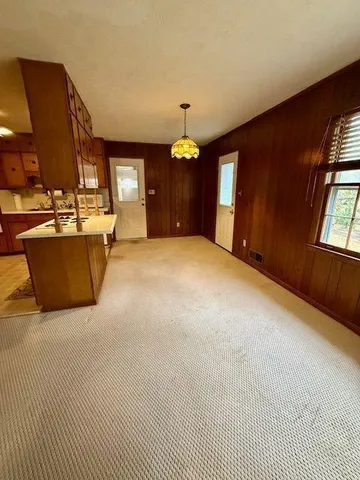 a view of a livingroom with furniture and window