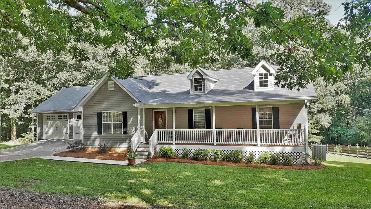 4542 Post Road Winston, GA 30187 - Photo 1 of 1 a front view of a house with a yard and porch