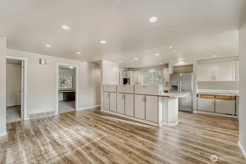 a view of kitchen with wooden floor
