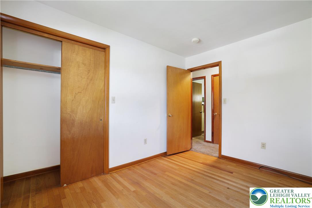 1539 Spring Garden Street Wilson, PA 18042 - Photo 18 of 34 Hardwood floors and classic wood trim define this inviting bedroom space.