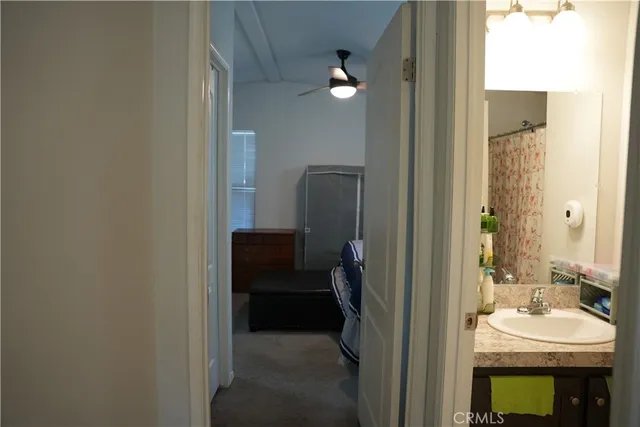 a en suite bathroom with a sink and a mirror