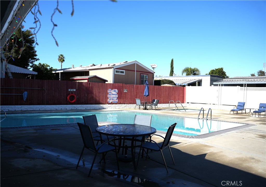 6545 Wilbur, Unit 39 Reseda, CA 91335 - Photo 24 of 27 a view of a patio with table and chairs and potted plants