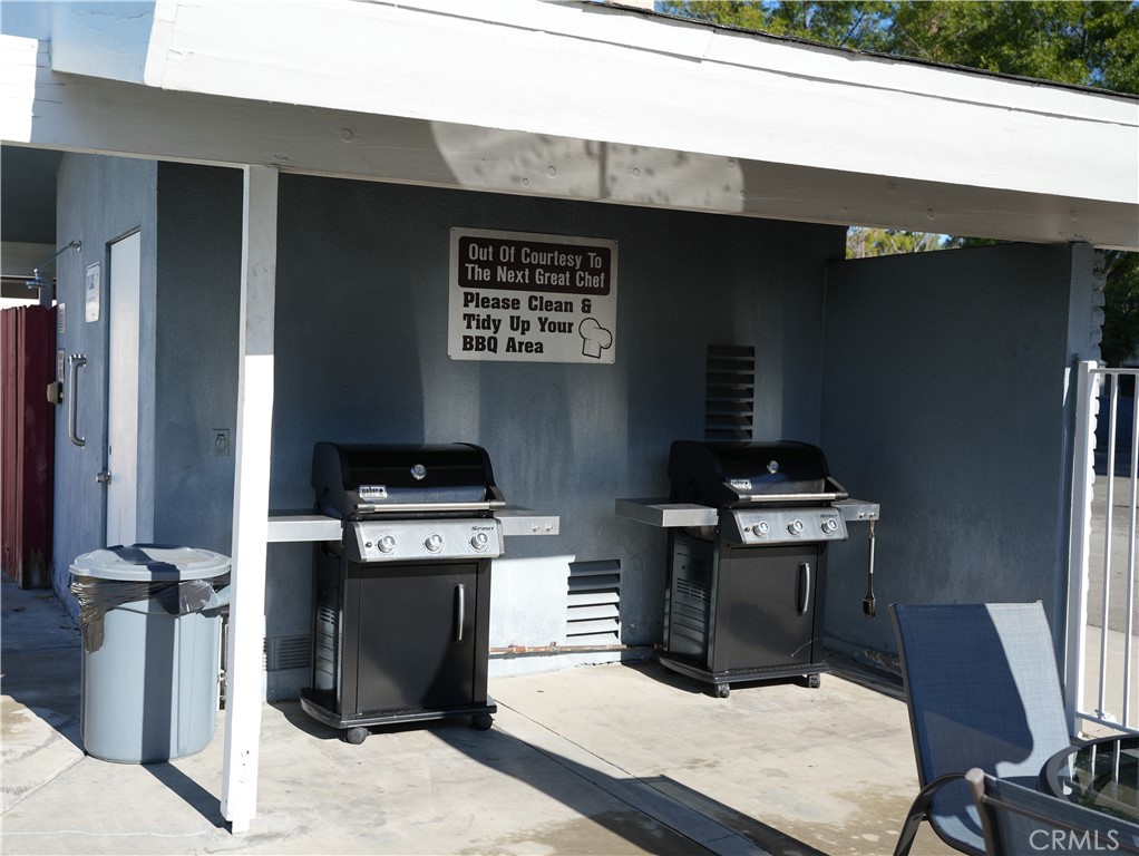 6545 Wilbur, Unit 39 Reseda, CA 91335 - Photo 25 of 27 a kitchen with stainless steel appliances kitchen island a stove and a refrigerator