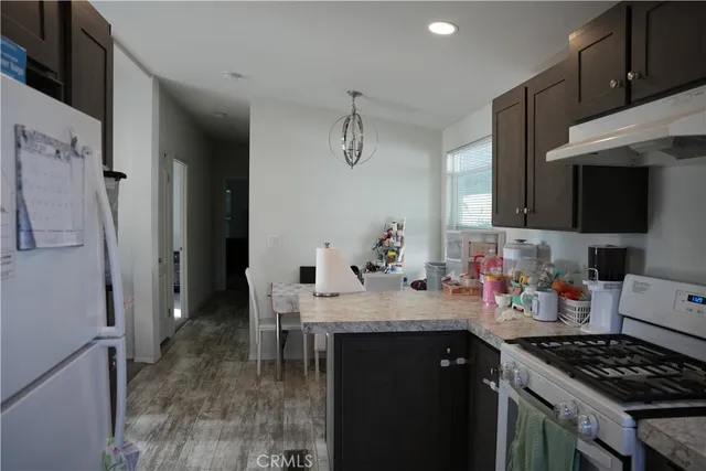 a kitchen with sink cabinets and stove