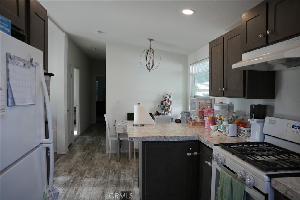 6545 Wilbur, Unit 39 Reseda, CA 91335 - Photo 7 of 27 a kitchen with sink cabinets and stove