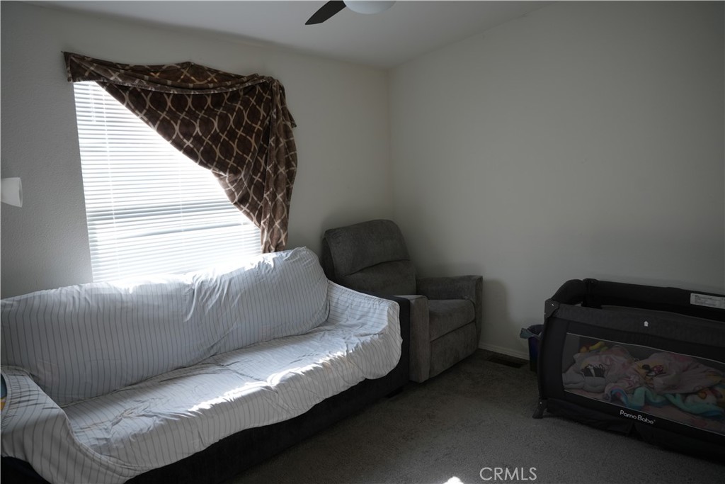 6545 Wilbur, Unit 39 Reseda, CA 91335 - Photo 10 of 27 a living room with furniture and a window