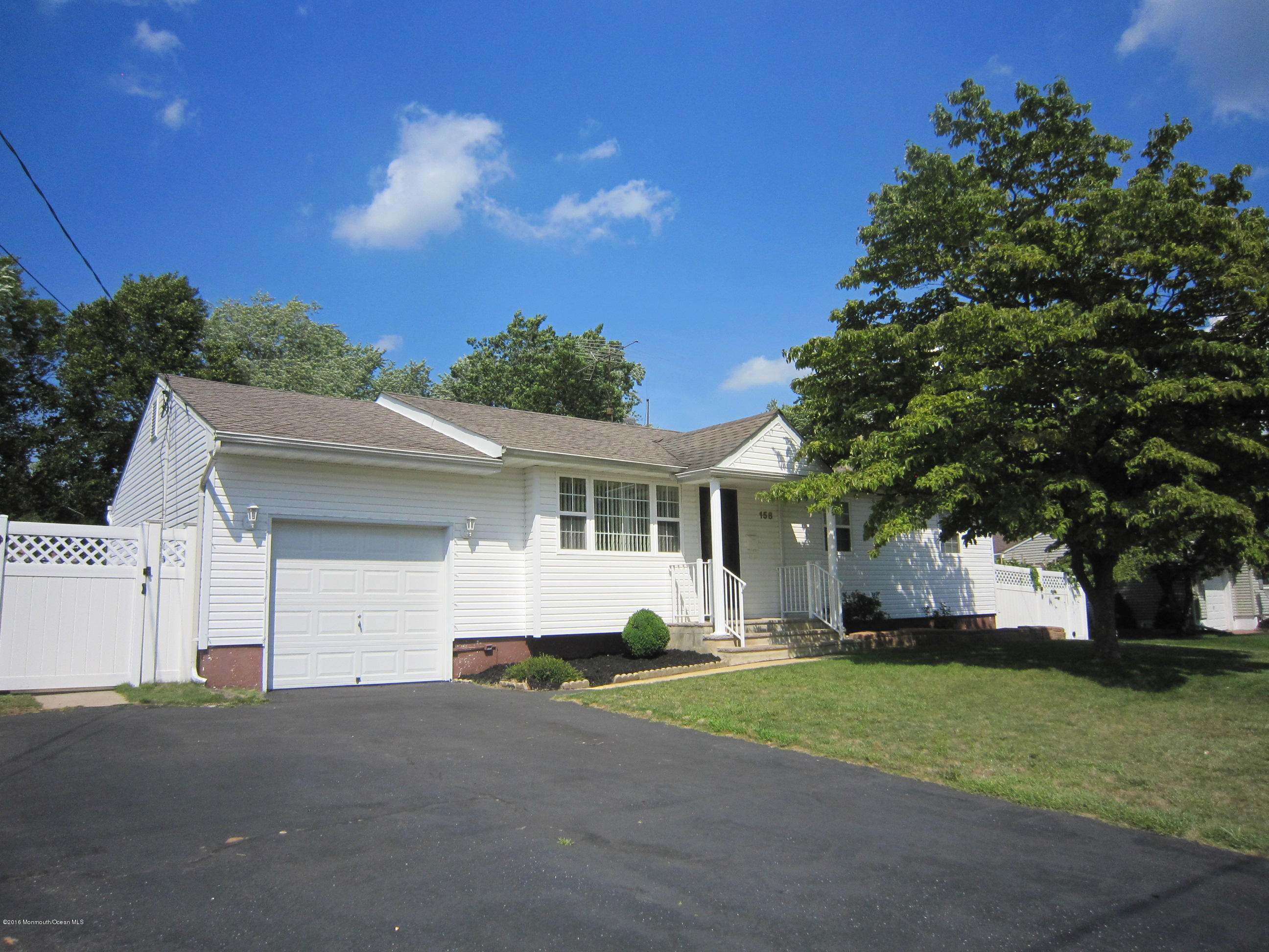 158 Newbury Road Howell, NJ 07731 - Photo 1 of 19 a house view with a garden space