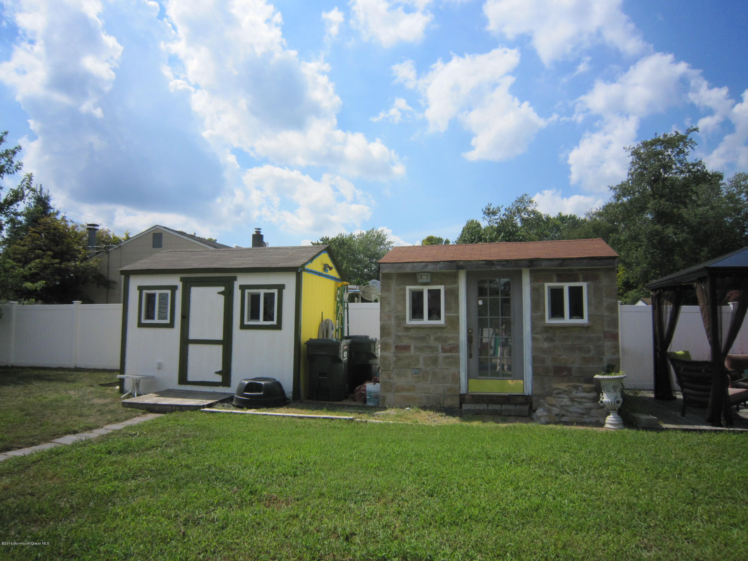 158 Newbury Road Howell, NJ 07731 - Photo 17 of 19 a front view of house with yard and green space