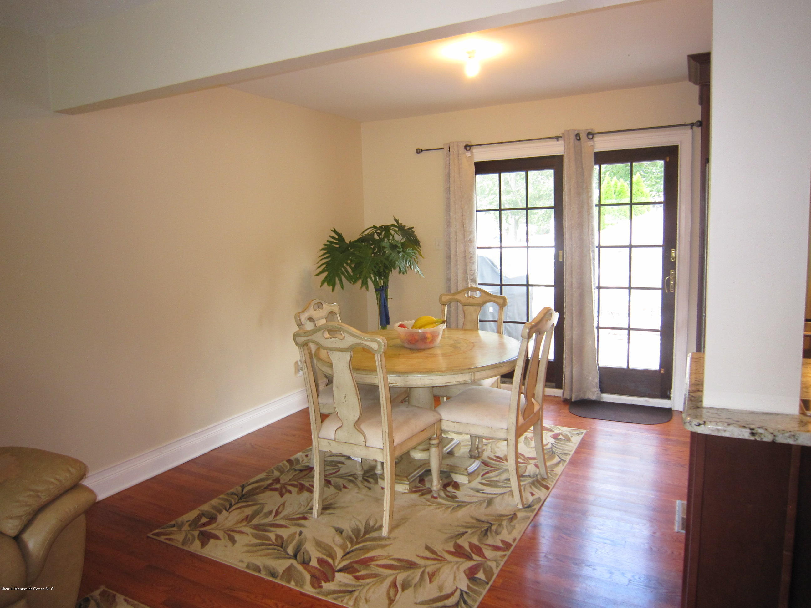 158 Newbury Road Howell, NJ 07731 - Photo 6 of 19 a view of a dining room with furniture and wooden floor