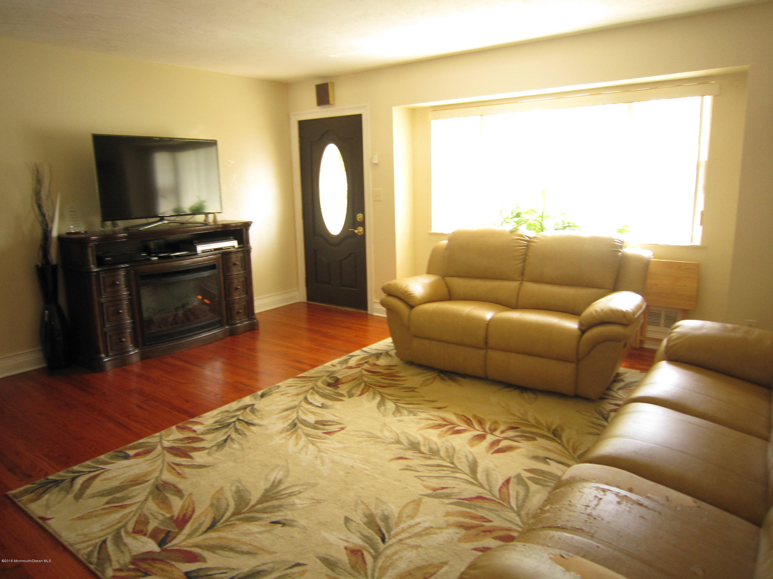 158 Newbury Road Howell, NJ 07731 - Photo 7 of 19 a living room with furniture and a flat screen tv