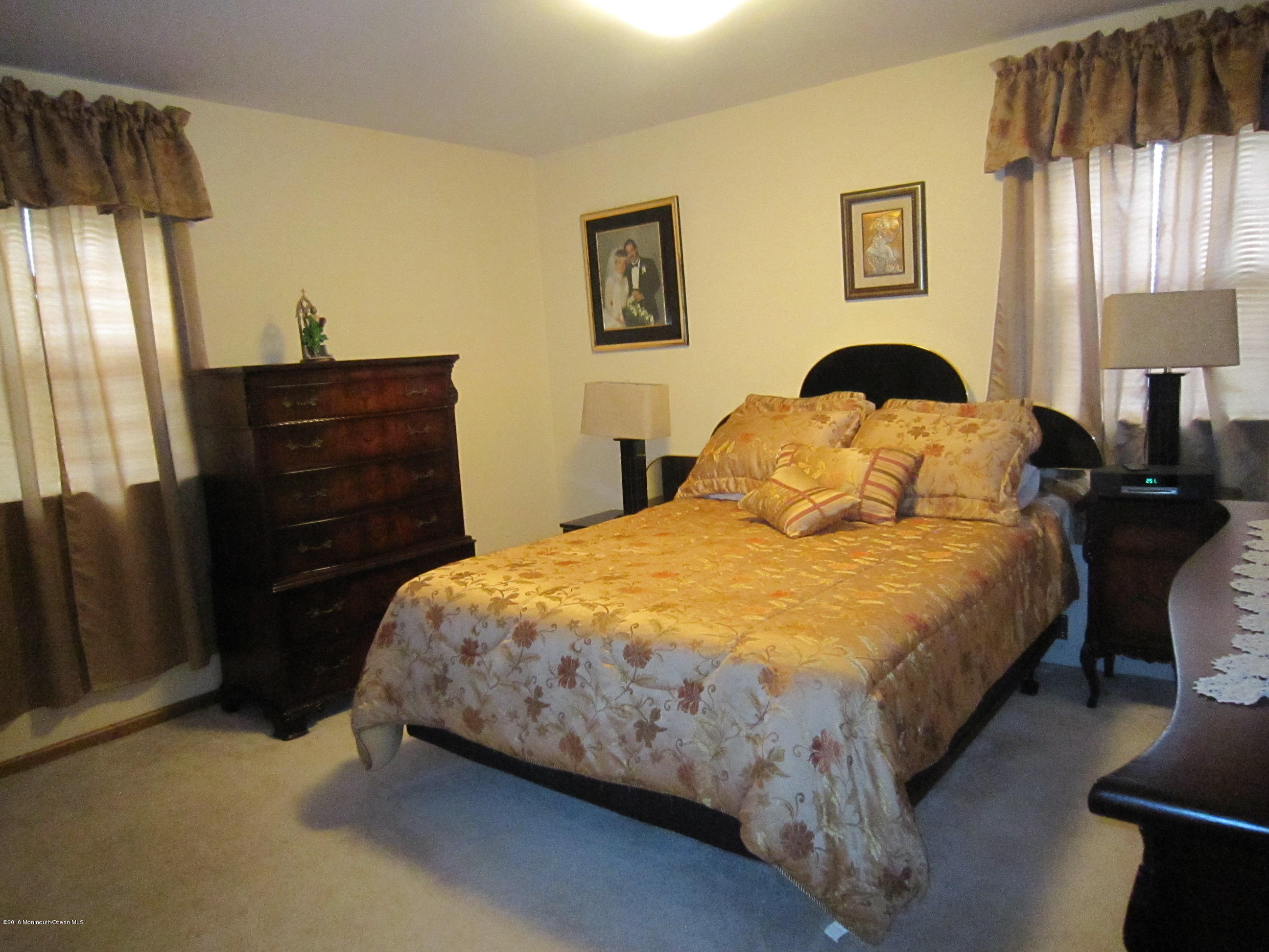 158 Newbury Road Howell, NJ 07731 - Photo 8 of 19 a bedroom with bed and wooden floor