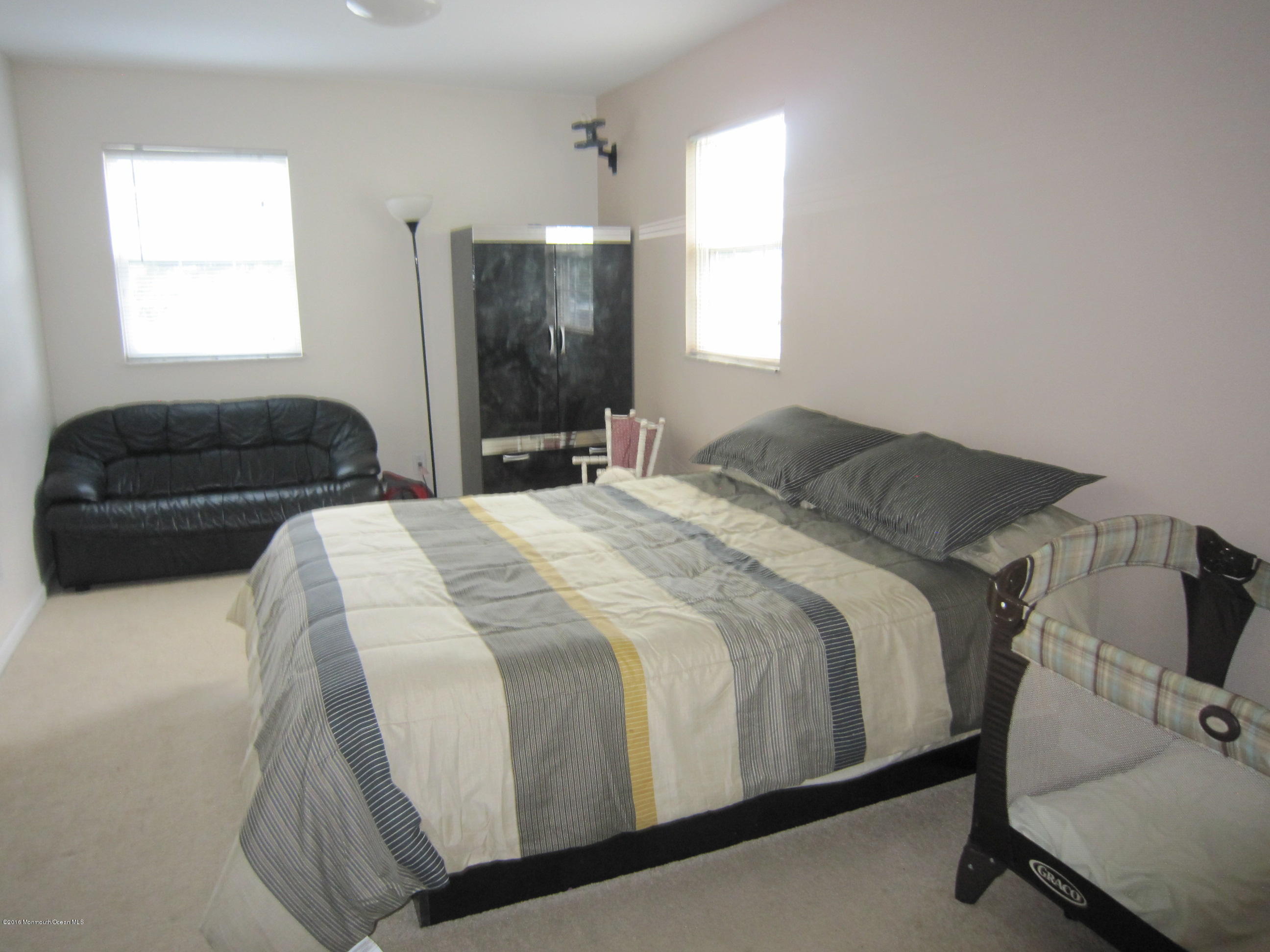 158 Newbury Road Howell, NJ 07731 - Photo 9 of 19 a bedroom with a bed and a window
