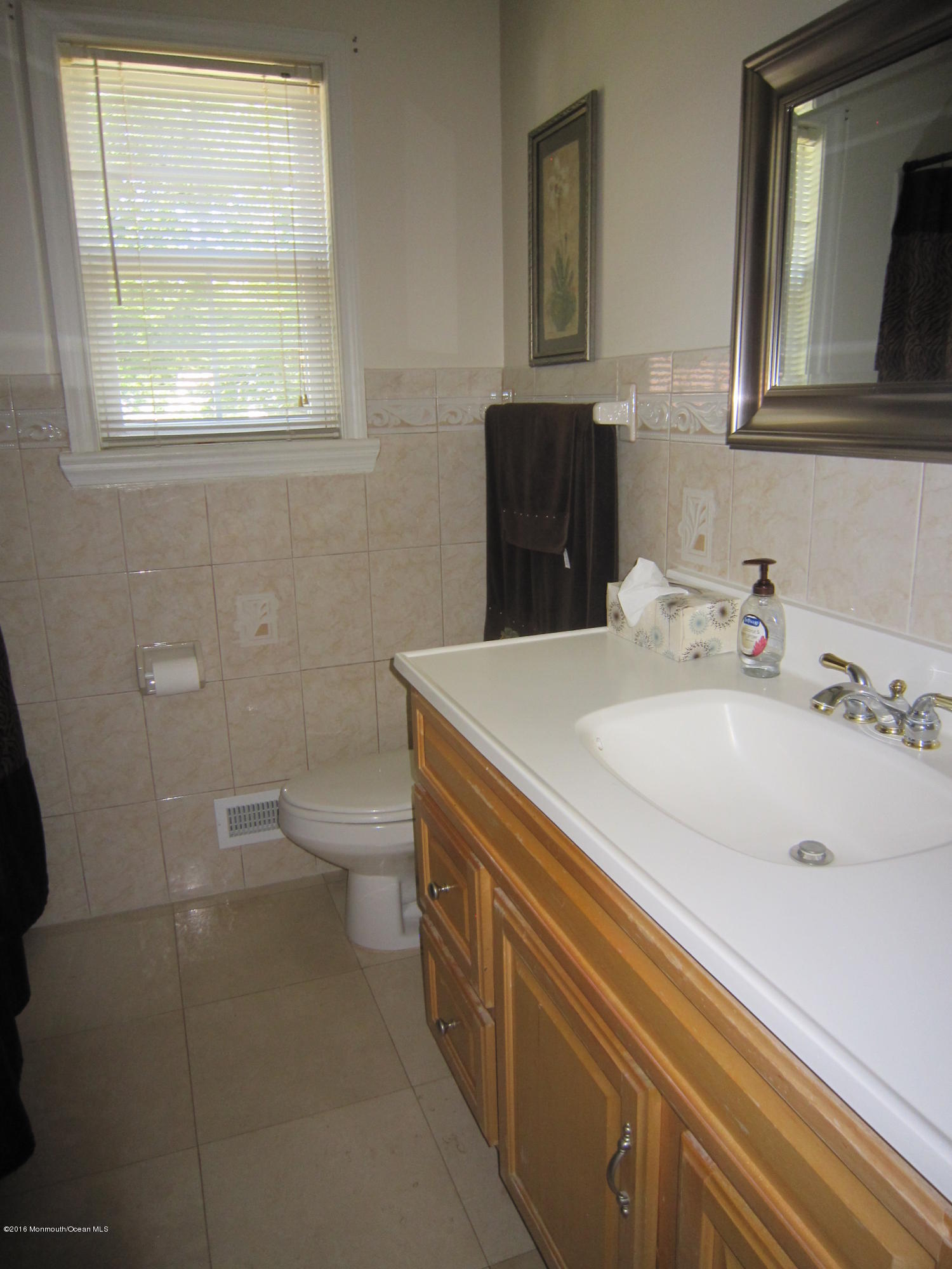 158 Newbury Road Howell, NJ 07731 - Photo 10 of 19 a bathroom with a sink a toilet and mirror