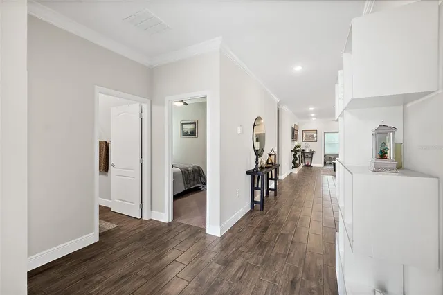 a large kitchen with stainless steel appliances granite countertop a lot of counter space and wooden floor