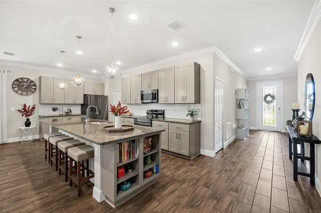 a large white kitchen with lots of counter top space