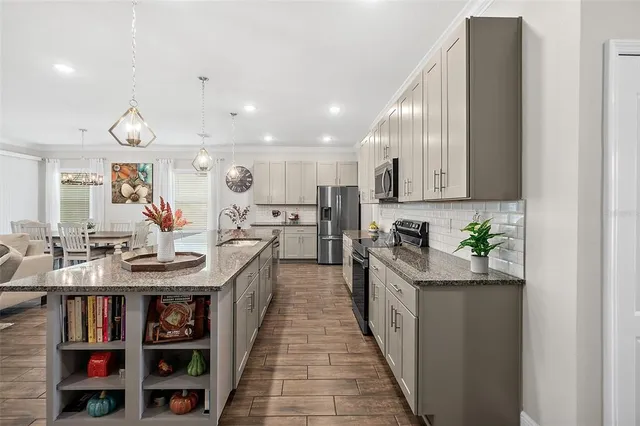 a kitchen with a stove and a microwave