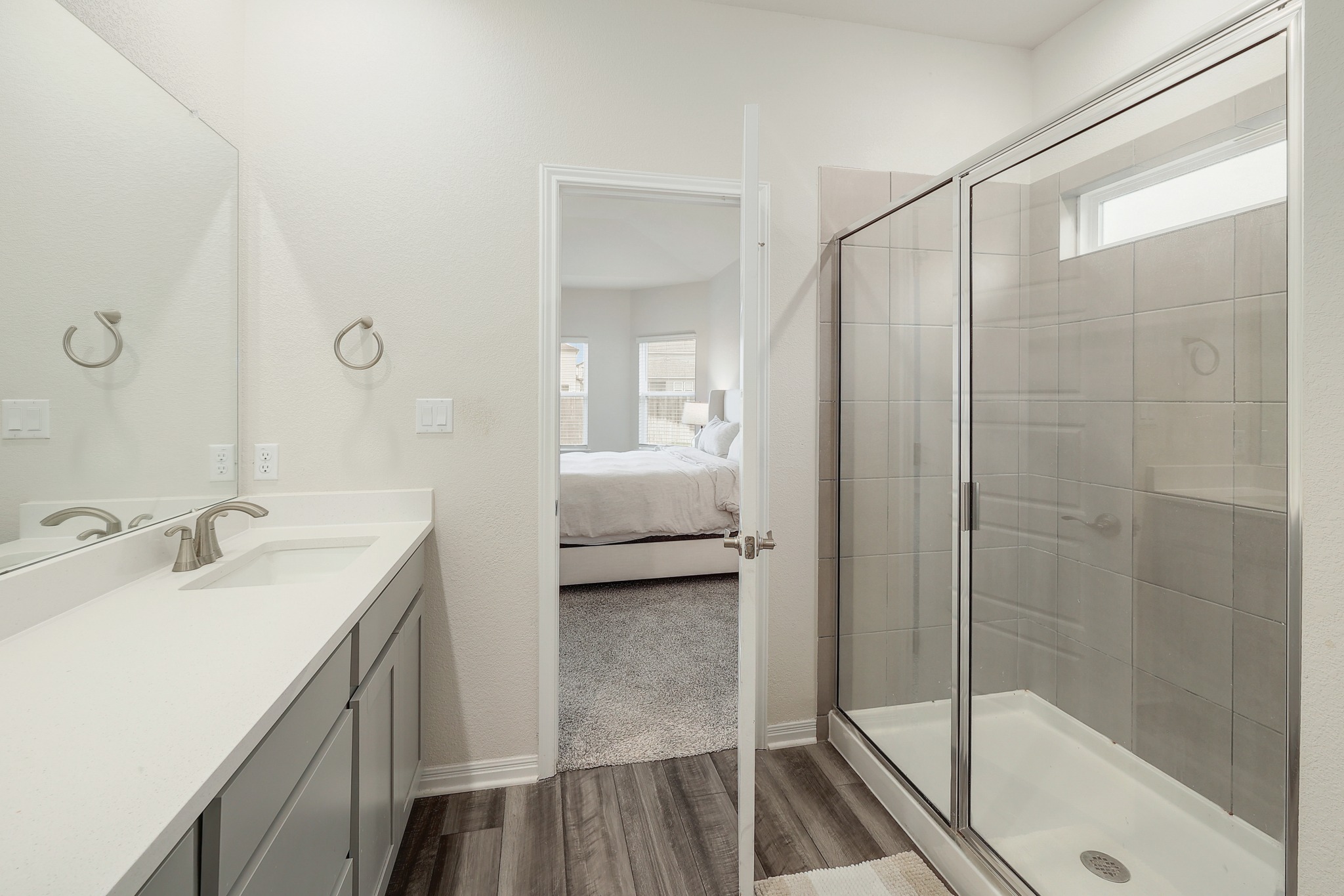 144 Sungrove Trail Georgetown, TX 78628 - Photo 13 of 40 The primary bathroom has a spacious walk in shower