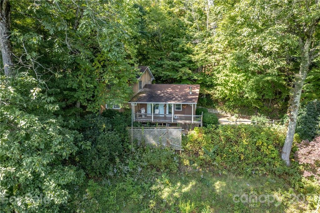 545 Old Fiddle Road Waynesville, NC 28786 - Photo 4 of 35 an aerial view of a house with yard and trees in the background