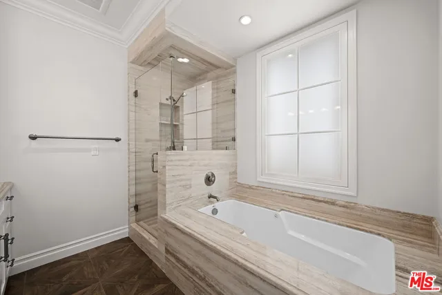 a bathroom with a bathtub and a shower