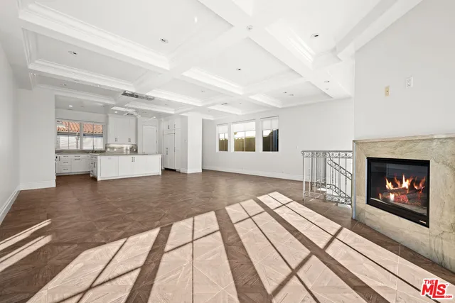 a view of an empty room with glass door