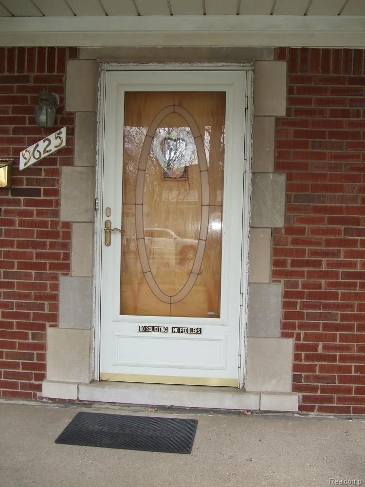 9625 Reeck Road Allen Park, MI 48101 - Photo 3 of 37 COVEREDFRONT PORCH. CUSTOM STONE WORK AROUND FRONT ENTRY DOOR.