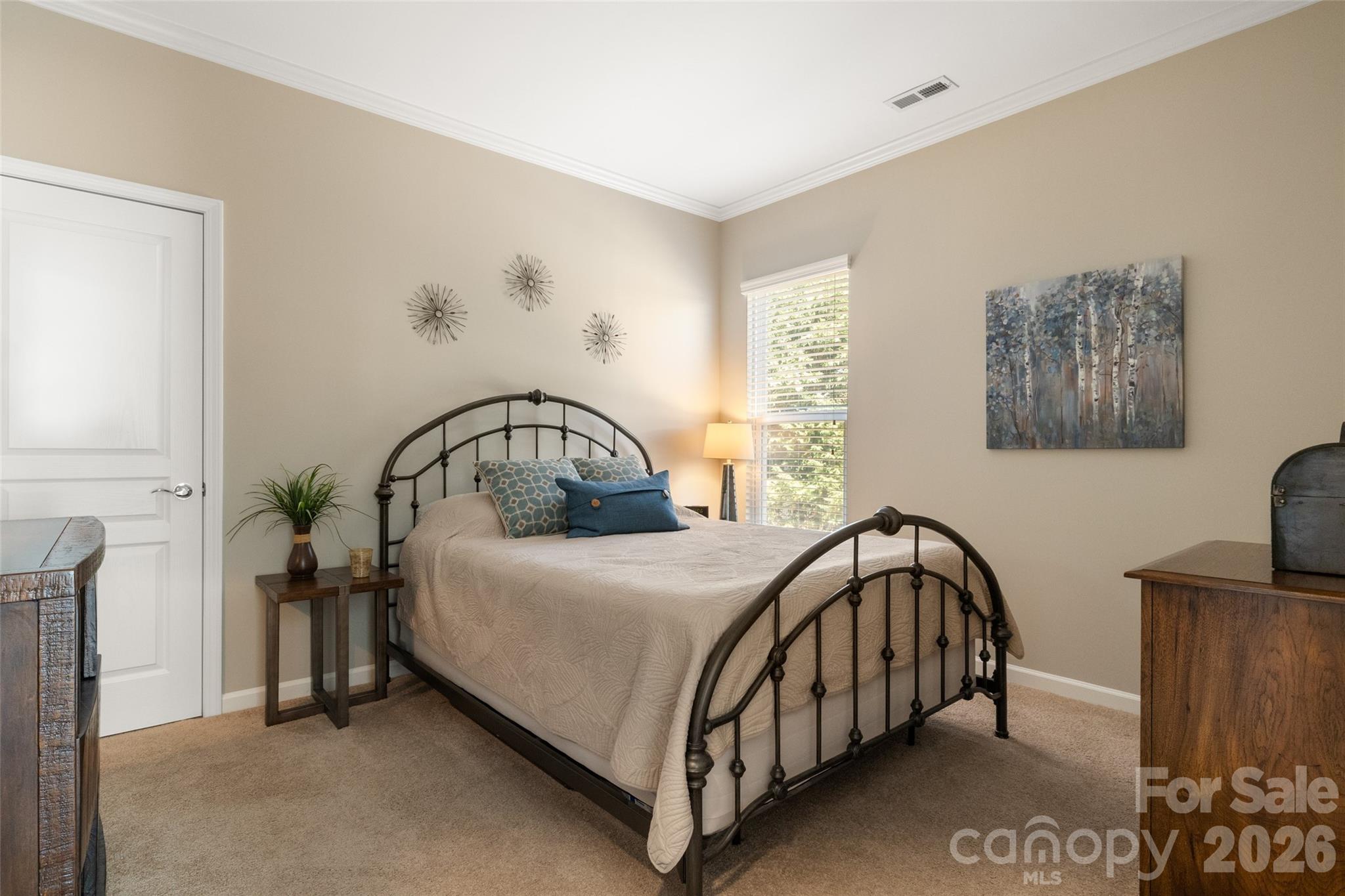 1002 Falling Leaf Street Indian Land, SC 29707 - Photo 22 of 45 a bedroom with a bed table and a window