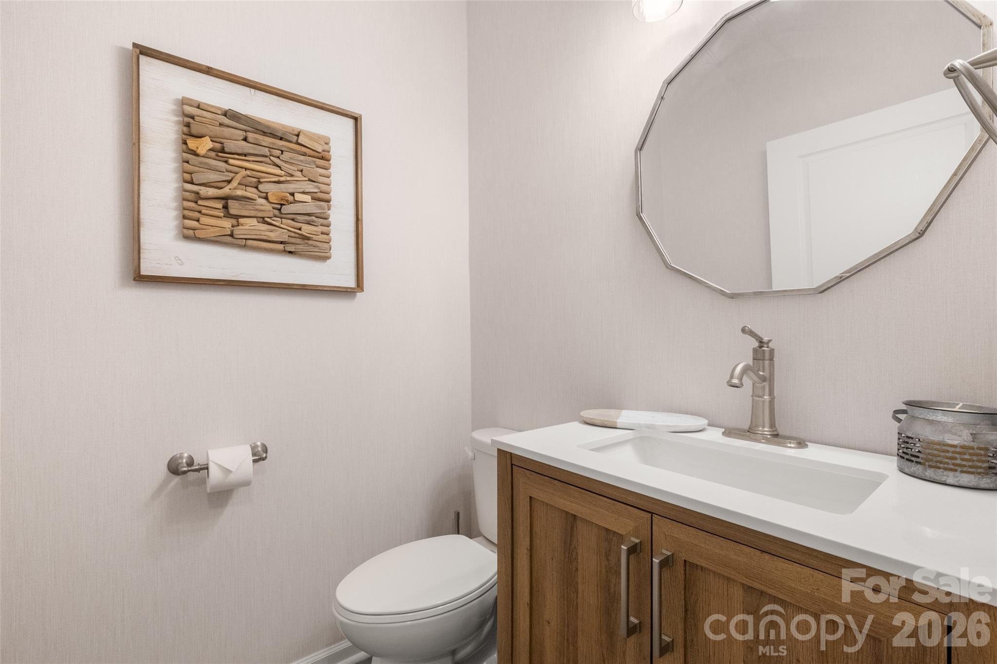 1002 Falling Leaf Street Indian Land, SC 29707 - Photo 24 of 45 a bathroom with a toilet a sink and mirror