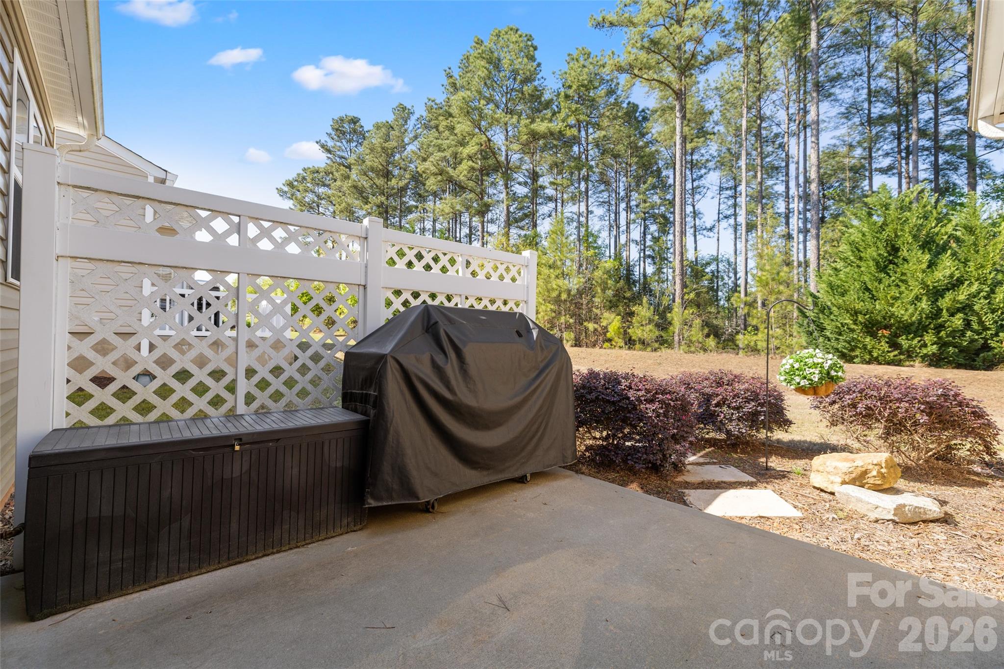 1002 Falling Leaf Street Indian Land, SC 29707 - Photo 29 of 45 a wooden bench sitting in front of a building