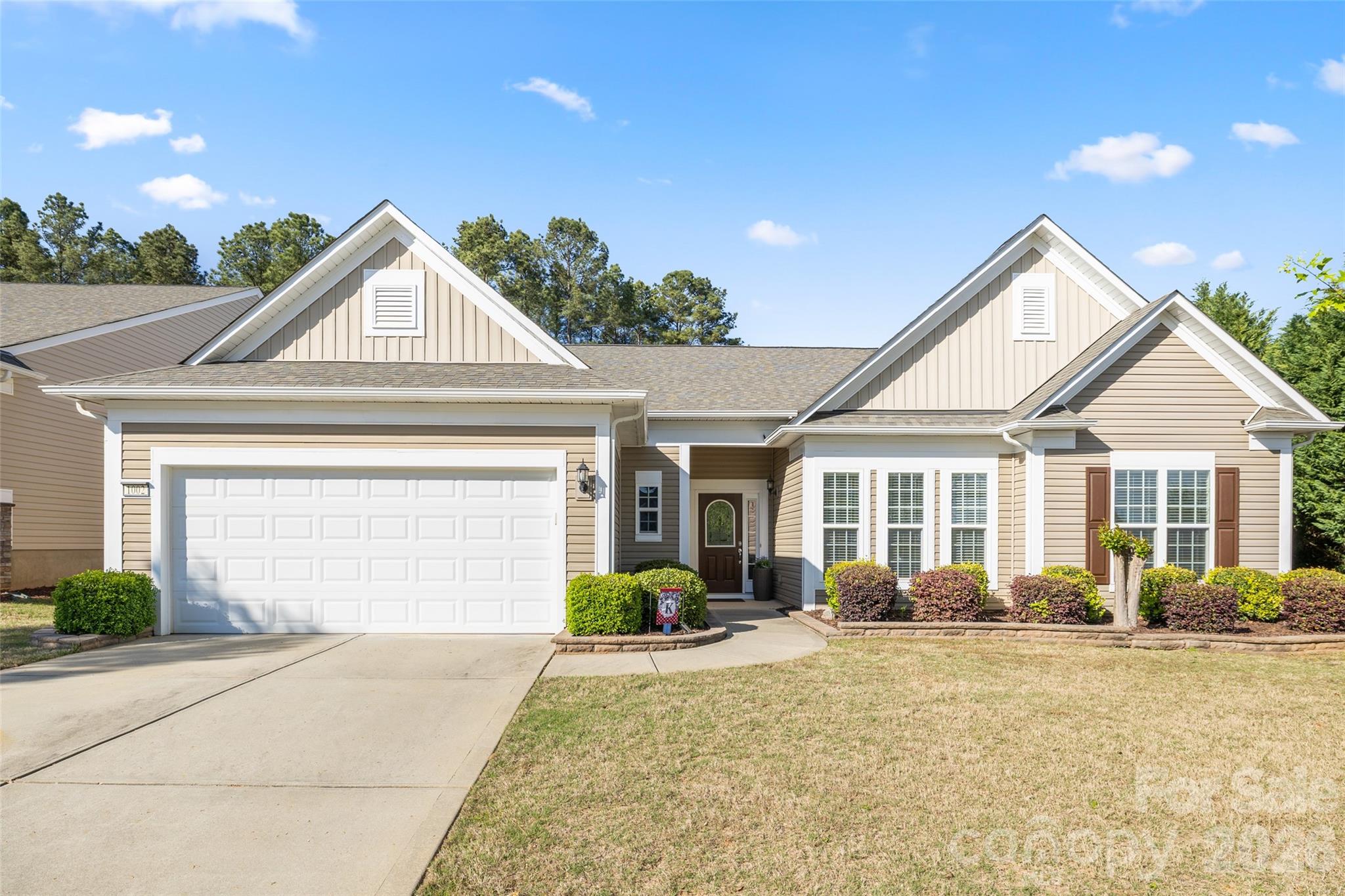 1002 Falling Leaf Street Indian Land, SC 29707 - Photo 5 of 45 a front view of a house with garden